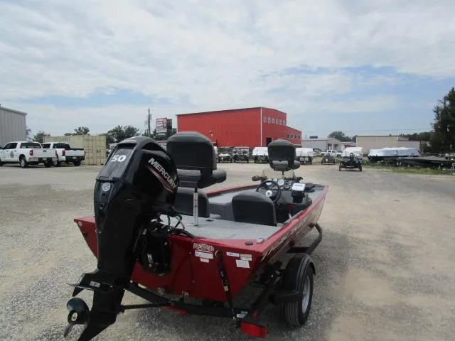 Slide: The Image of 2024 Tracker Pro 170 boat with Mercury 50 outboard motor in a dealership lot. - 17