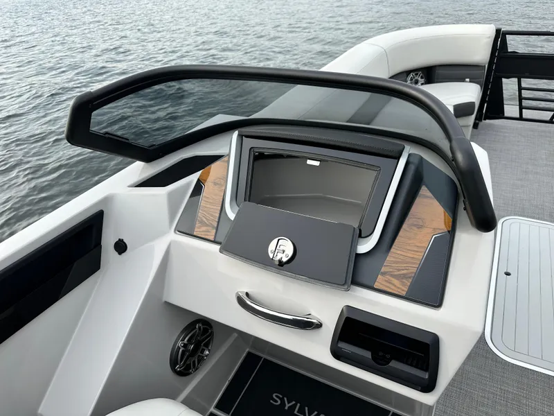 Slide: The Image of 2024 Sylvan G5 CLZ DC boat dashboard with modern design and storage compartment. - 18