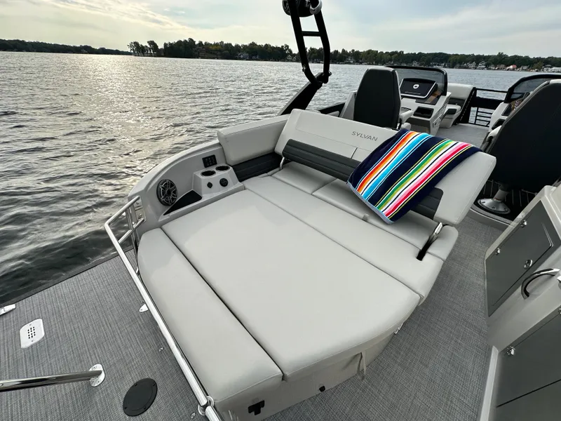 Slide: The Image of 2024 Sylvan G5 CLZ DC boat with spacious seating on a serene lake. - 20