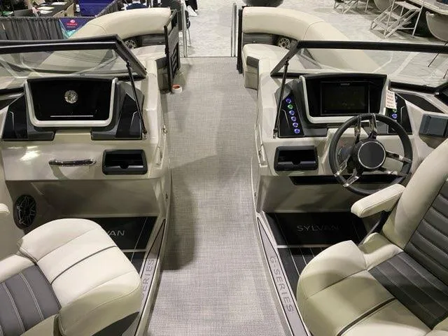 Slide: The Image of 2024 Sylvan G5 CLZ DC boat interior with dual consoles and modern dashboard. - 5