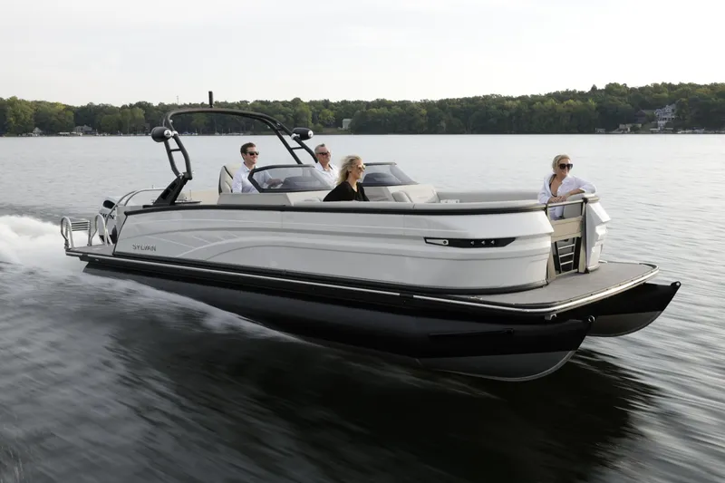 Slide: The Image of 2024 Sylvan G5 CLZ DC pontoon boat cruising on a lake with passengers. - 8