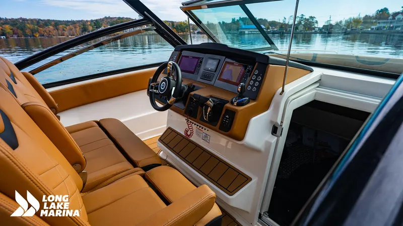 Slide: The Image of 2024 Chaparral 300 OSX boat interior with modern dashboard at Long Lake Marina. - 27