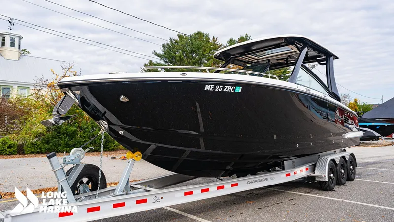 Slide: The Image of 2024 Chaparral 300 OSX boat on trailer at Long Lake Marina. - 30