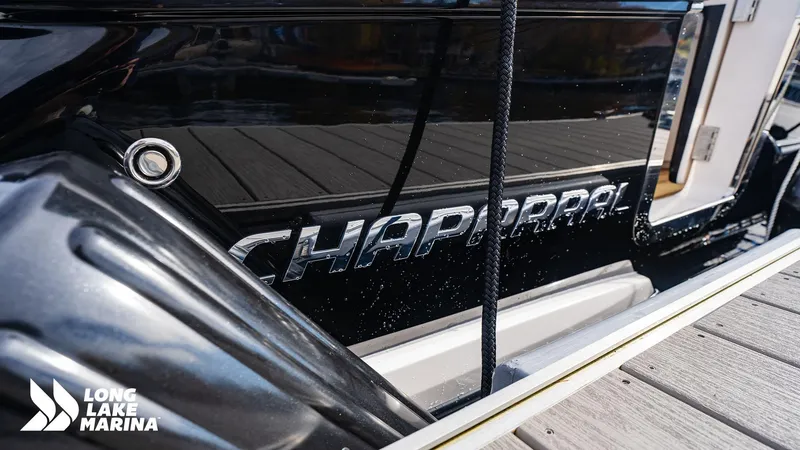 Slide: The Image of 2024 Chaparral 300 OSX boat docked at Long Lake Marina. - 5