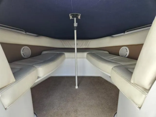 Slide: The Image of Interior cabin of a 2008 Cobalt 252 boat with cushioned seating. - 14