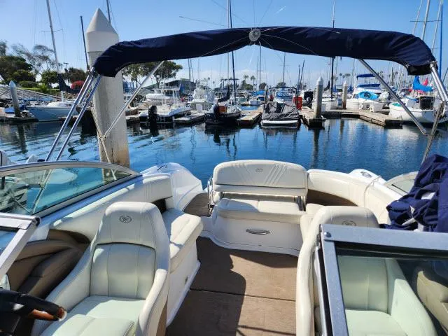 Slide: The Image of 2008 Cobalt 252 boat docked in a marina with other boats. - 20