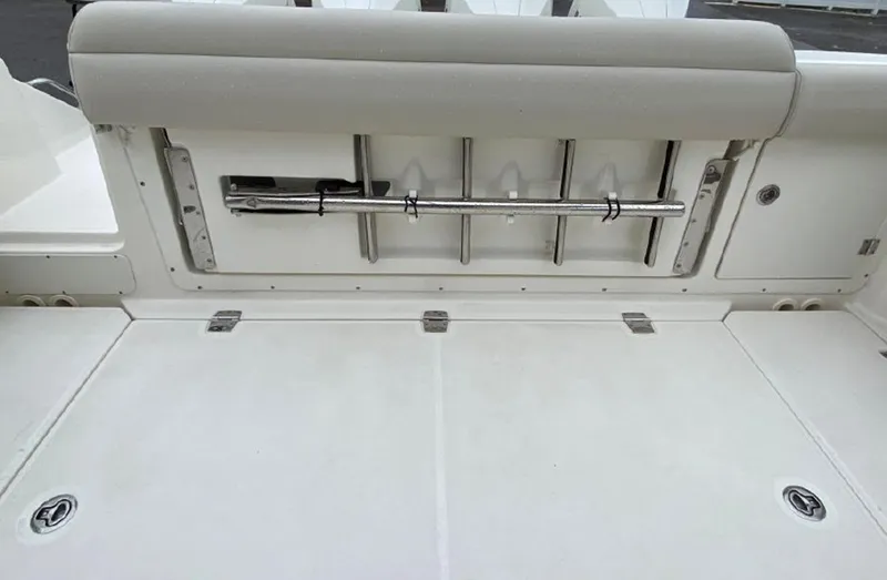 Slide: The Image of 2020 Boston Whaler 380 Outrage fishing rod holders and storage compartment. - 31