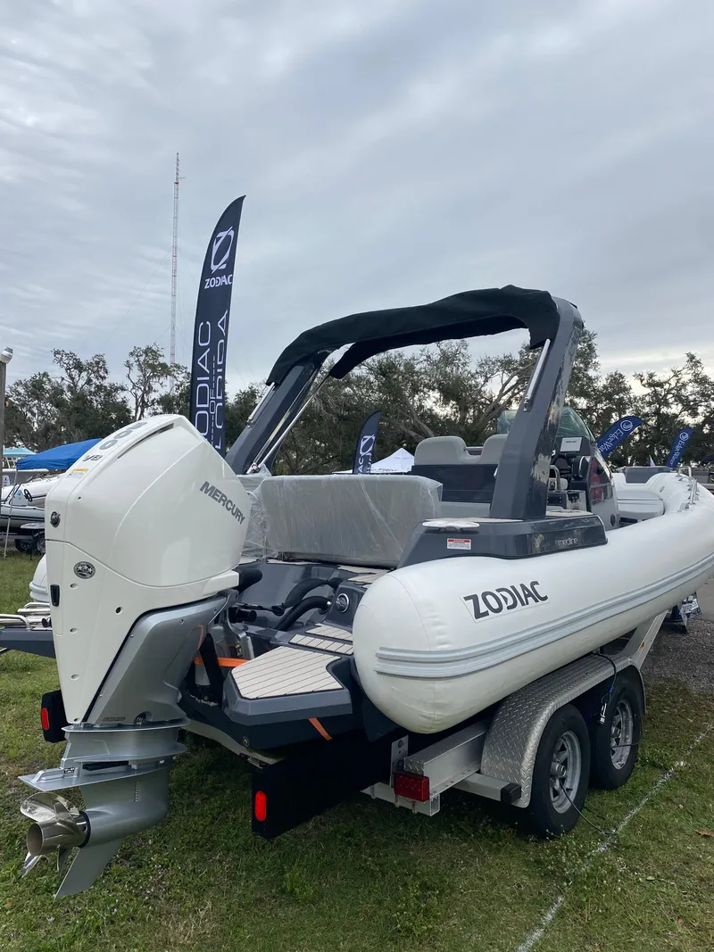 Slide: The Image of 2024 Zodiac Medline 7.5 inflatable boat on a trailer, displayed outdoors. - 11