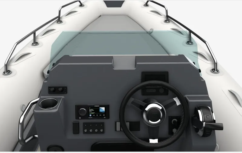 Slide: The Image of 2024 Zodiac Medline 7.5 boat dashboard with steering wheel and control panel. - 3