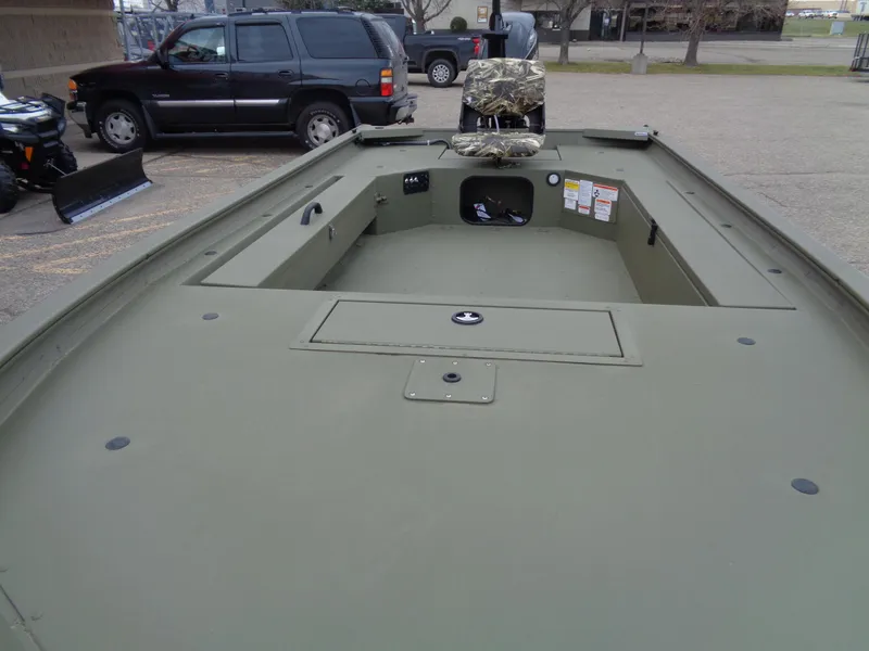 Slide: The Image of 2024 Tracker Grizzly 1654 T Sportsman boat interior with camo seat. - 10