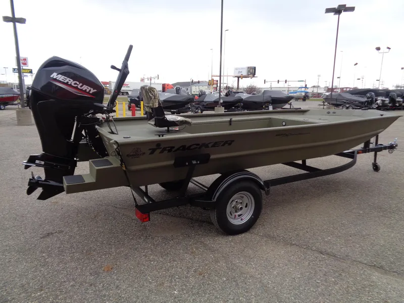 Slide: The Image of 2024 Tracker Grizzly 1654 T Sportsman boat with Mercury outboard motor on trailer. - 5