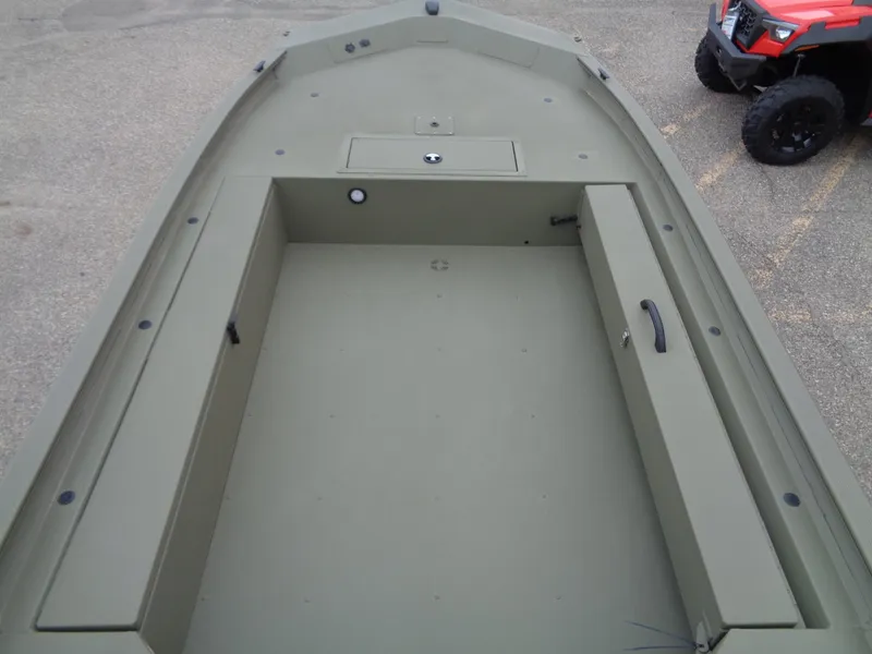 Slide: The Image of 2024 Tracker Grizzly 1654 T Sportsman boat interior, spacious storage compartment. - 8