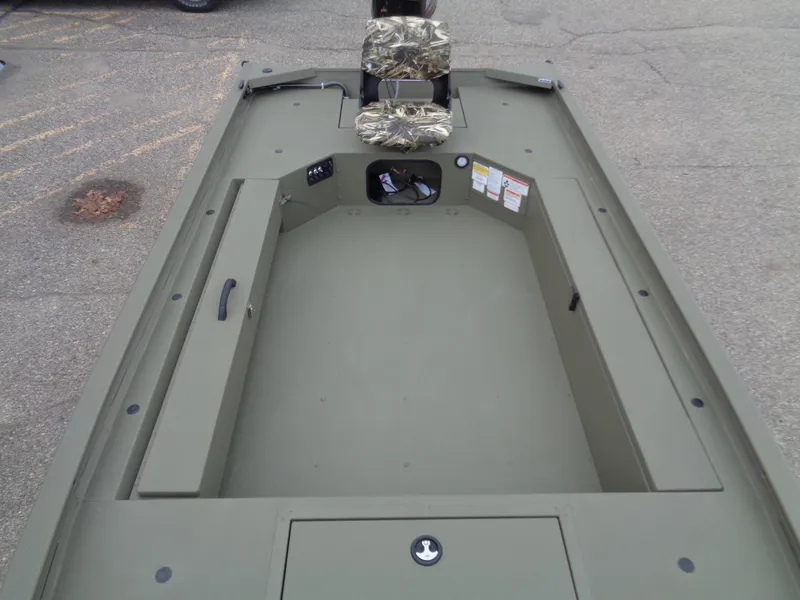 Slide: The Image of 2024 Tracker Grizzly 1654 T Sportsman boat interior, olive green, camo seat. - 9