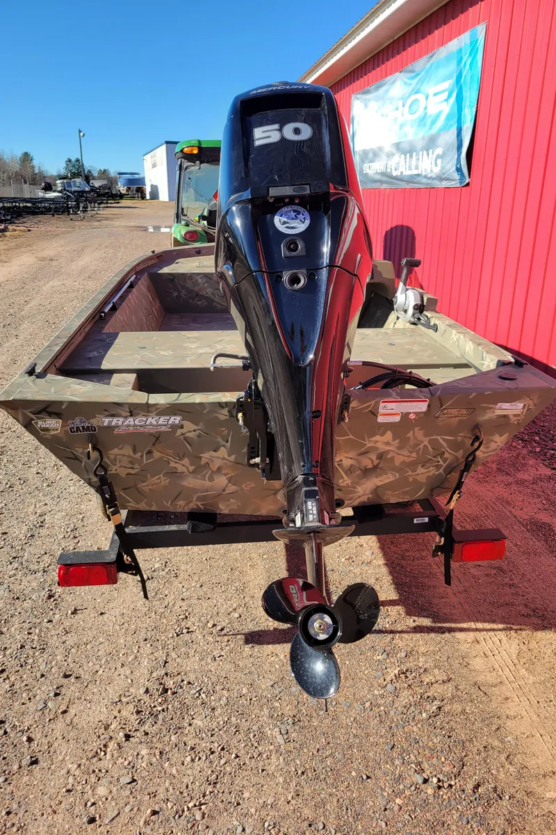 Slide: The Image of 2024 Tracker Grizzly 1648 SC boat with 50 HP outboard motor. - 7