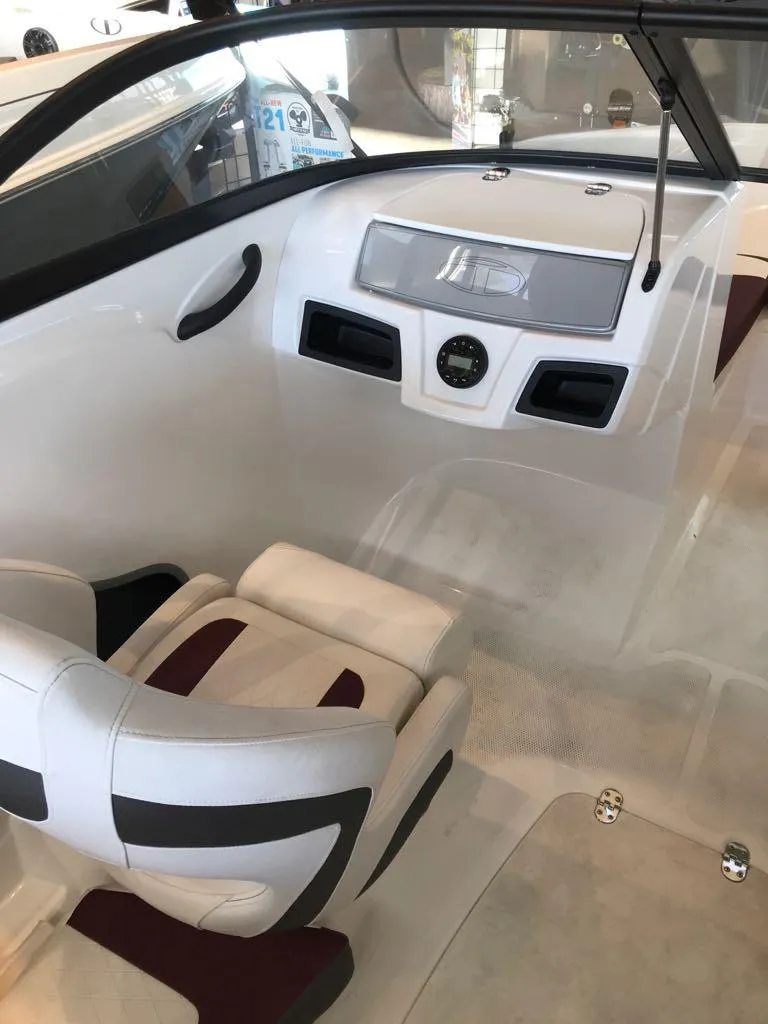 Slide: The Image of 2024 Tahoe 185 S boat interior with modern dashboard and seating. - 5