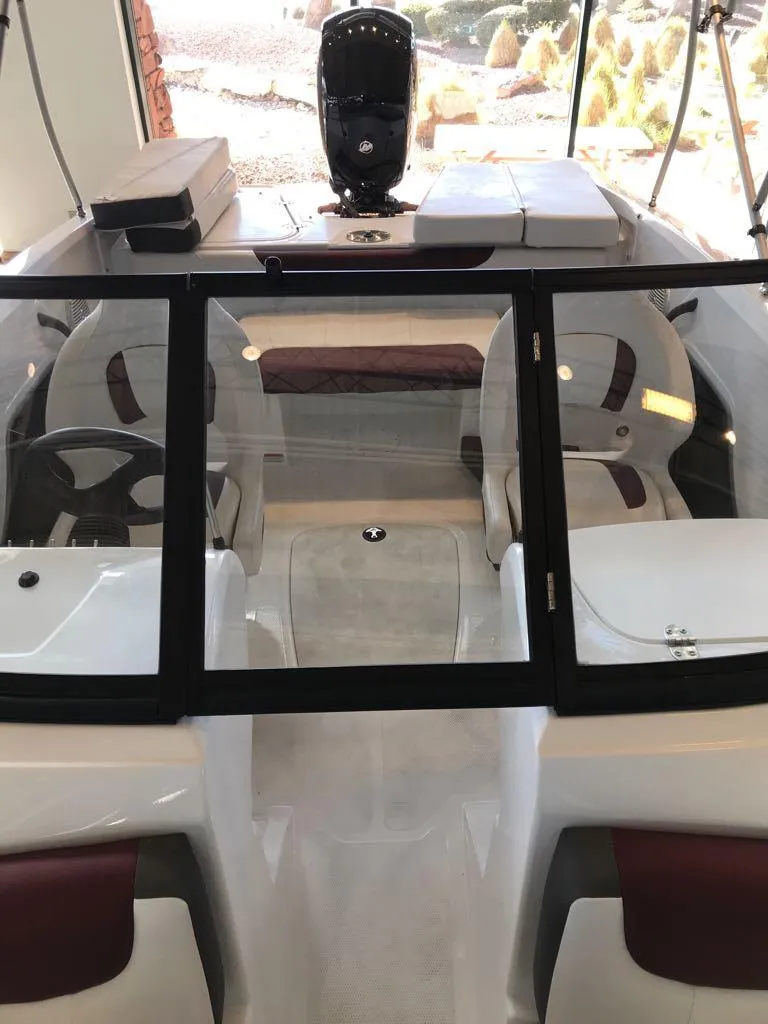 Slide: The Image of 2024 Tahoe 185 S boat interior with seating and steering wheel. - 8