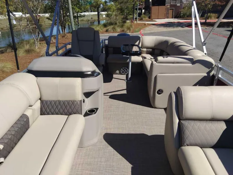Slide: The Image of 2024 Sun Tracker Party Barge 20 DLX interior with plush seating and modern design. - 13