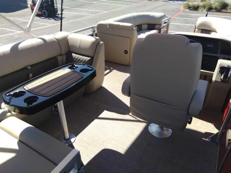 Slide: The Image of Interior of 2024 Sun Tracker Party Barge 20 DLX pontoon boat with beige seating. - 18