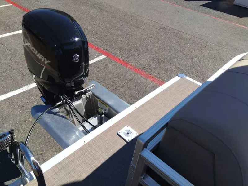 Slide: The Image of 2024 Sun Tracker Party Barge 20 DLX pontoon boat with Mercury outboard motor. - 5