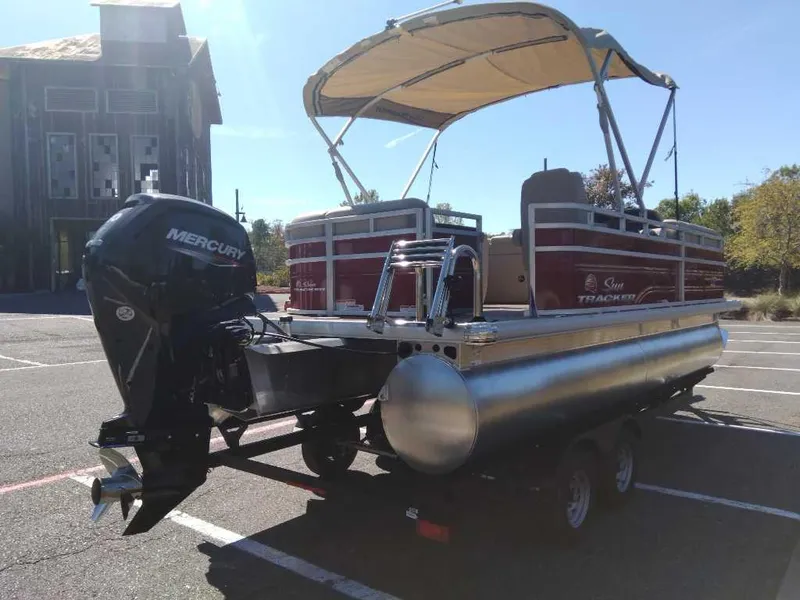 Slide: The Image of 2024 Sun Tracker Party Barge 20 DLX pontoon boat with Mercury outboard motor. - 6