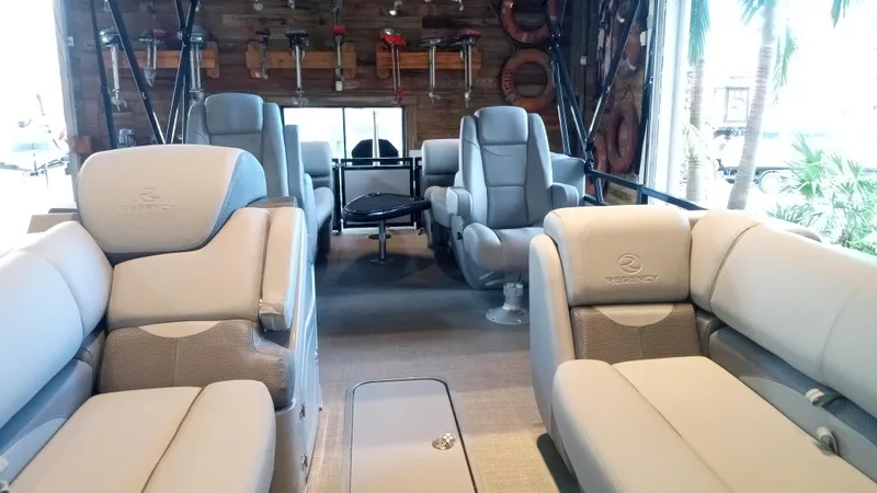 Slide: The Image of Luxurious interior of the 2024 Regency 230 DL3 pontoon boat with plush seating. - 4