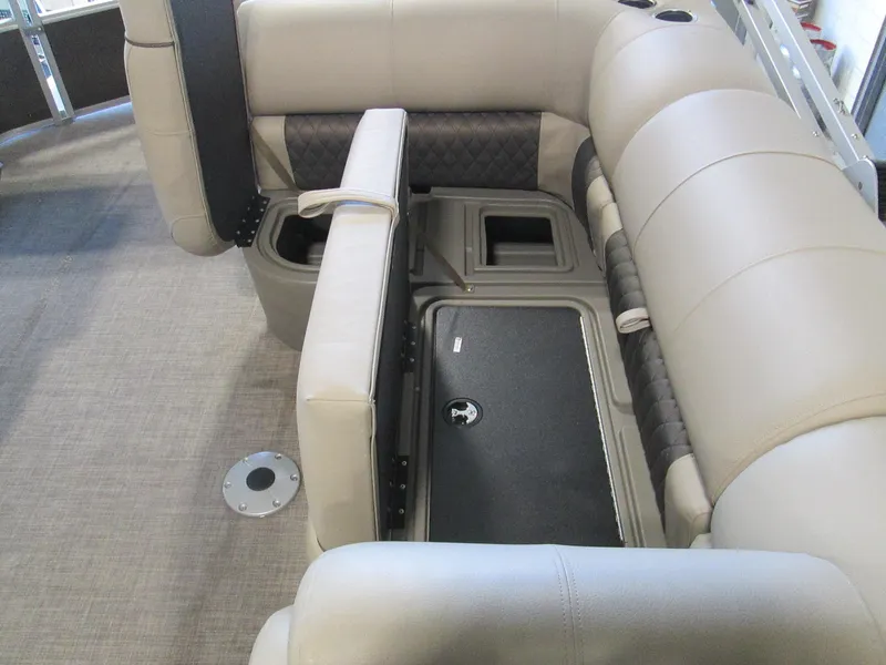 Slide: The Image of 2023 Sun Tracker SPORT FISH 22 XP3 boat interior with beige seating and storage compartments. - 10