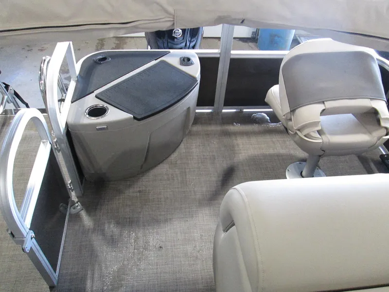 Slide: The Image of 2023 Sun Tracker SPORT FISH 22 XP3 boat interior with seating and storage. - 25
