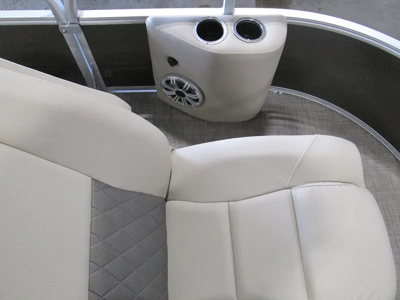 Slide: The Image of 2023 Sun Tracker SPORT FISH 22 XP3 boat interior with beige seating and cup holders. - 28