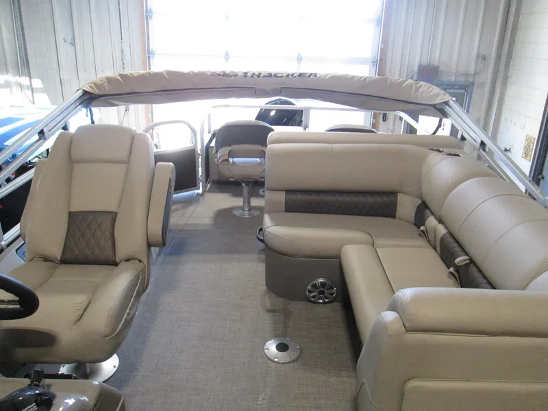 Slide: The Image of 2023 Sun Tracker SPORT FISH 22 XP3 pontoon boat interior with beige seating. - 6