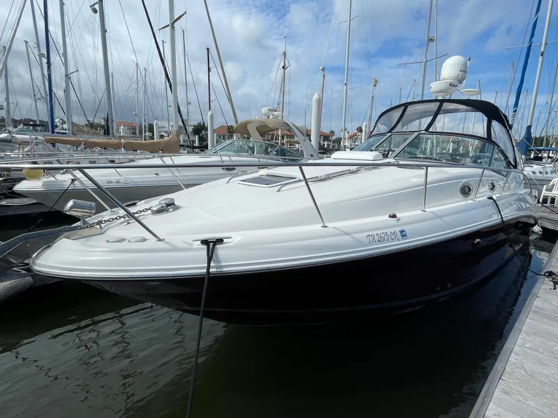 Slide: The Image of 2006 Sea Ray 320 Sundancer yacht docked at marina. - 5