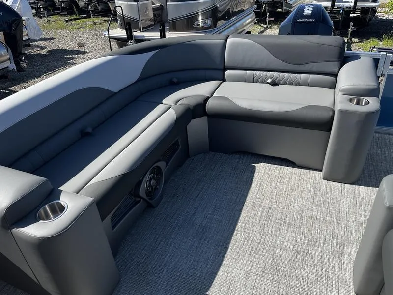 Slide: The Image of 2024 Avalon LSZ boat interior with gray seating and cup holders. - 2