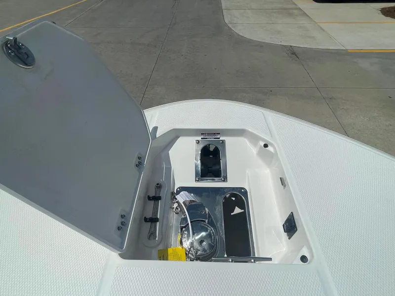 Slide: The Image of 2023 Robalo R270 boat anchor storage compartment. - 22