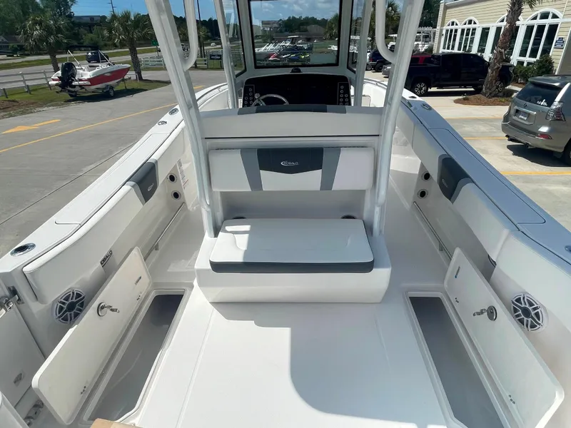 Slide: The Image of 2023 Robalo R270 boat interior with open storage compartments. - 12