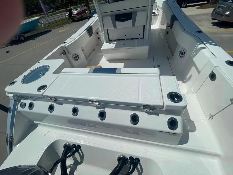 Slide: The Image of 2023 Robalo R270 boat interior with seating and storage compartments. - 7