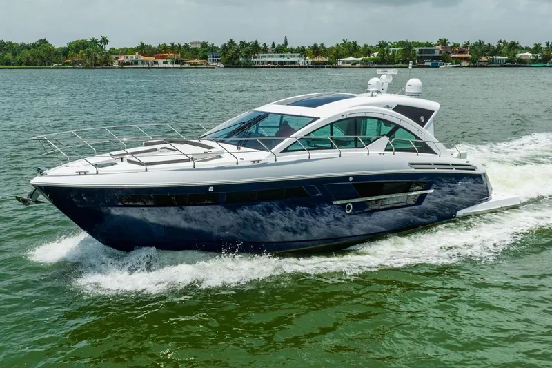 Slide: The Image of 2018 Cruisers Yachts CANTIUS 54 luxury yacht cruising on water. - 0