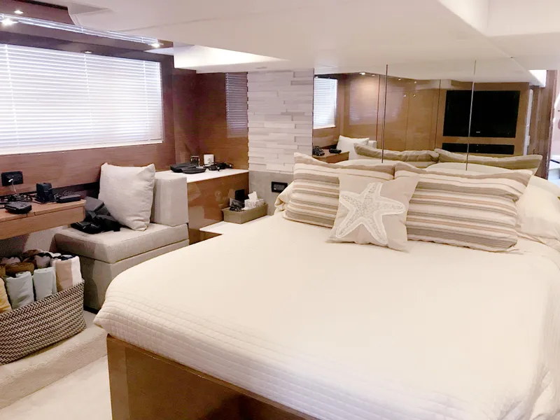 Slide: The Image of Luxurious bedroom interior of 2018 Cruisers Yachts CANTIUS 54 with modern decor and cozy seating area. - 10