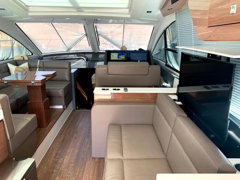 Slide: The Image of Luxurious interior of 2018 Cruisers Yachts CANTIUS 54 with modern seating and entertainment system. - 2