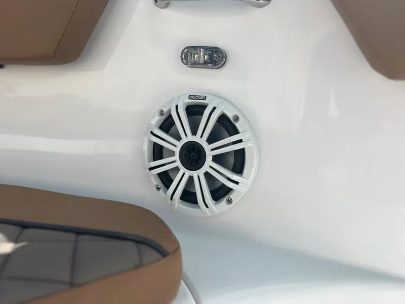 Slide: The Image of 2024 Clearwater 2200 boat interior with speaker and seating. - 29