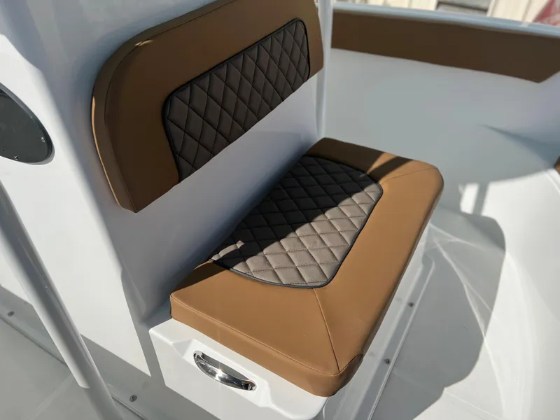 Slide: The Image of 2024 Clearwater 2200 boat seat with brown and black diamond-stitched upholstery. - 31