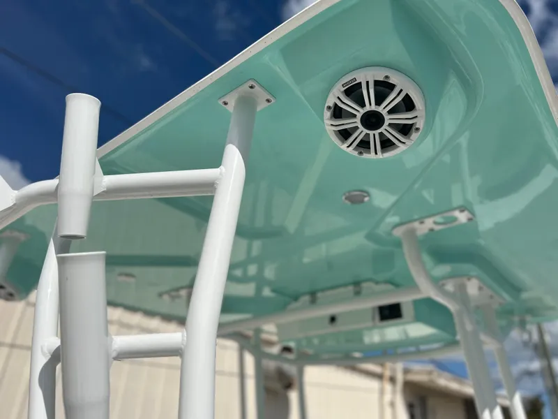 Slide: The Image of 2024 Clearwater 2200 boat T-top with integrated speaker system. - 36