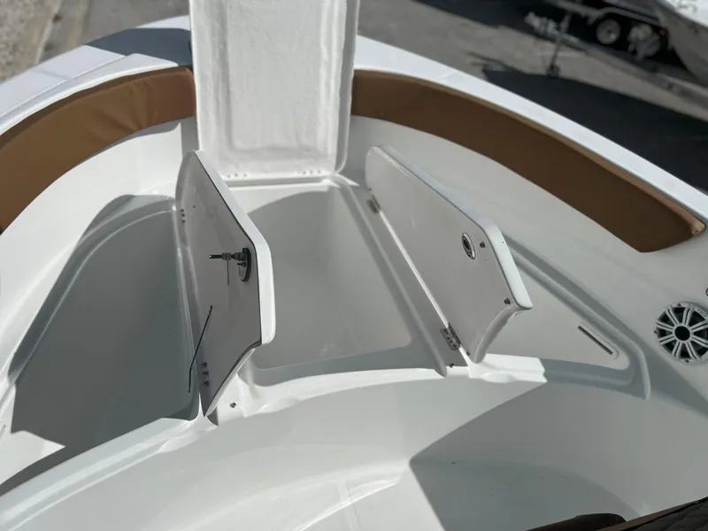Slide: The Image of 2024 Clearwater 2200 boat with open storage compartments. - 40
