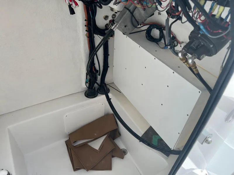 Slide: The Image of 2024 Clearwater 2200 boat wiring and storage compartment - 42