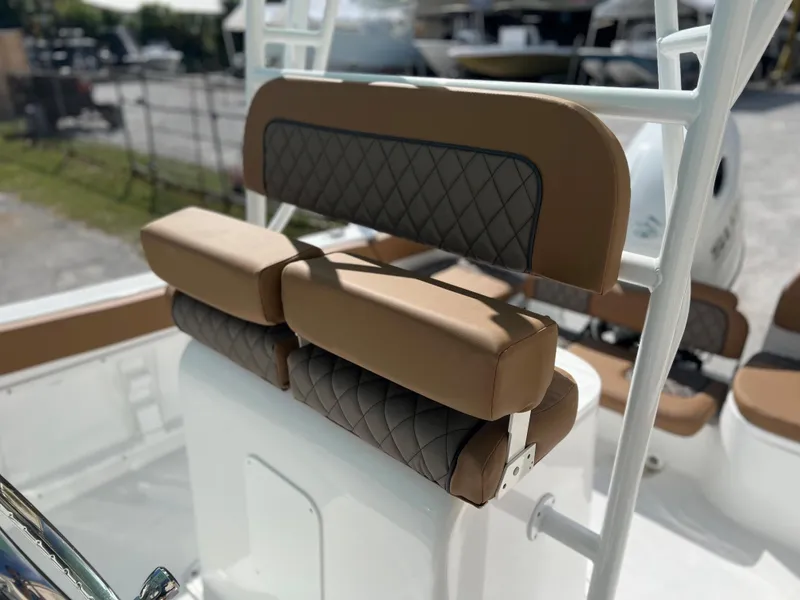 Slide: The Image of 2024 Clearwater 2200 boat with cushioned seating and diamond-stitched upholstery. - 43