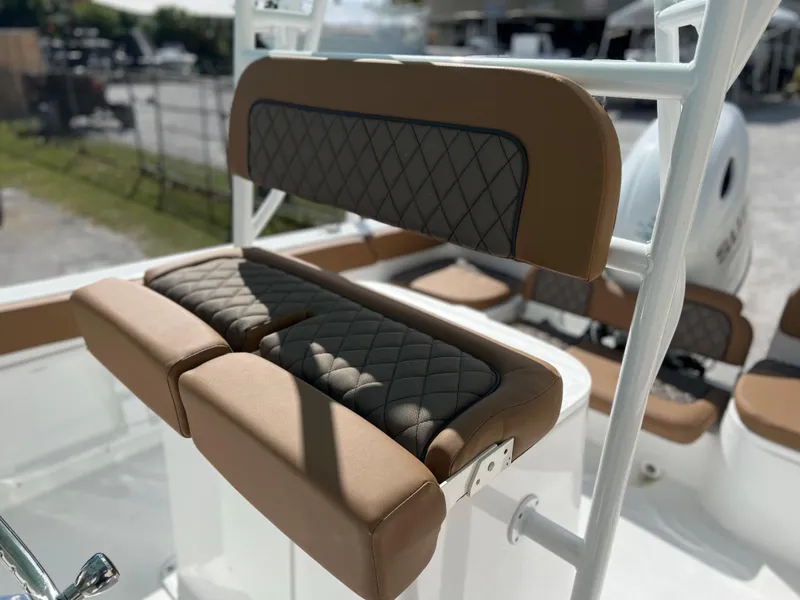 Slide: The Image of 2024 Clearwater 2200 boat with cushioned seating and diamond-stitched upholstery. - 44