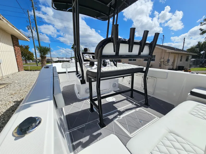 Slide: The Image of Clearwater 2000 boat 2023 model, interior view with seating and rod holders. - 11