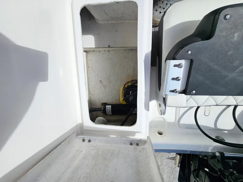 Slide: The Image of Clearwater 2000 boat storage compartment, 2023 model, with visible equipment inside. - 16