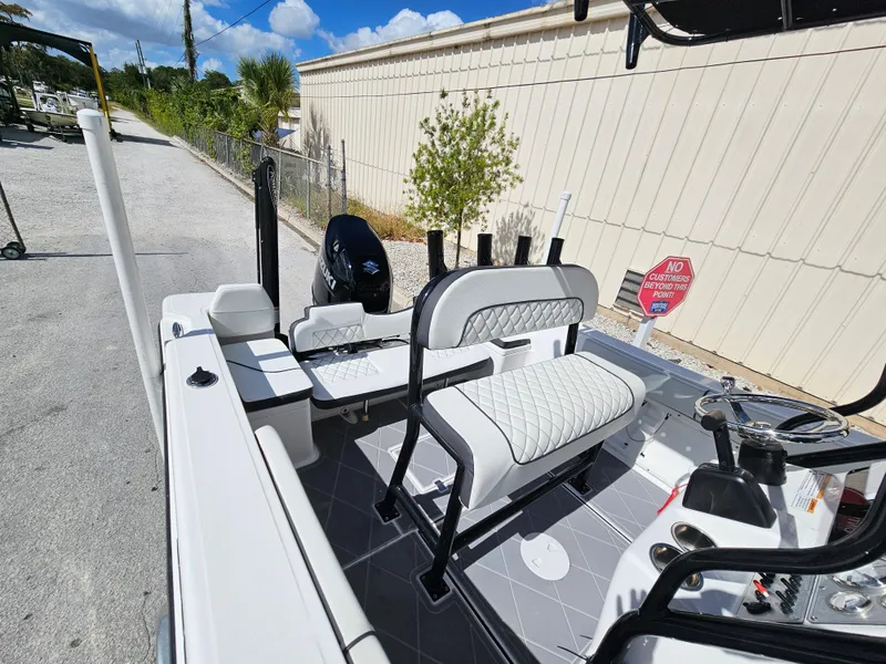 Slide: The Image of 2023 Clearwater 2000 boat with white seating and modern design. - 19