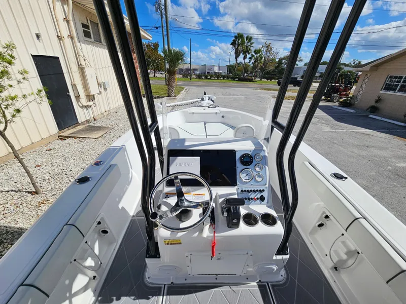 Slide: The Image of Clearwater 2000 boat 2023 model, center console with steering wheel and navigation equipment. - 20