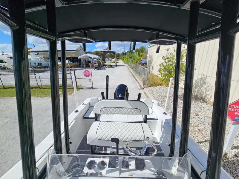 Slide: The Image of Clearwater 2000 boat, 2023 model, interior view with steering console and seating. - 22