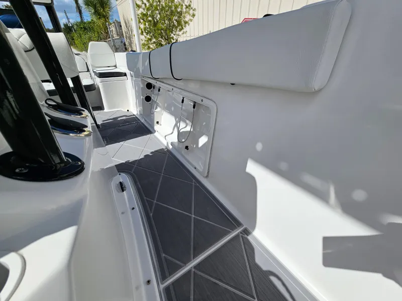Slide: The Image of Clearwater 2000 boat interior, 2023 model, featuring white seating and grey flooring. - 23